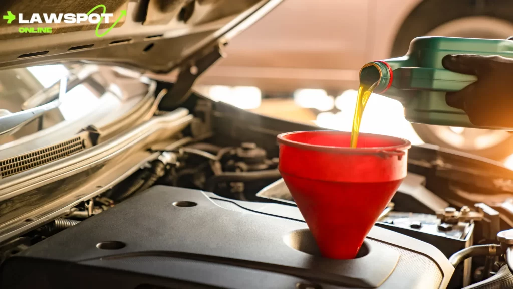 Fresh oil being poured into a car's engine. How long do oil changes take?